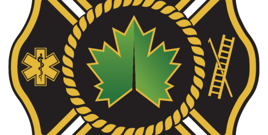 A black and gold fire department emblem featuring a green maple leaf in the center, surrounded by the words Village of Maple Bluff and symbols of emergency medical services, a fire hydrant, and a ladder with a pike pole.